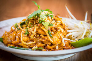 Stir-fry noodles with shrimp, vegetables, and peanuts